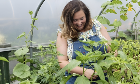 Victoria Holden, Director of Northern Lily CIC, tending to plants in one of the polytunnels