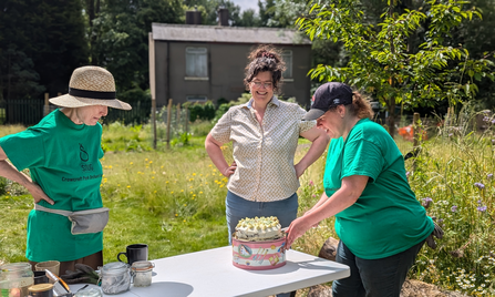 Sharing cake with volunteers and Elsa from The Orchard Project