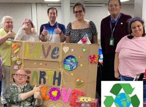 Green Superheroes smiling with their recycled arts and crafts